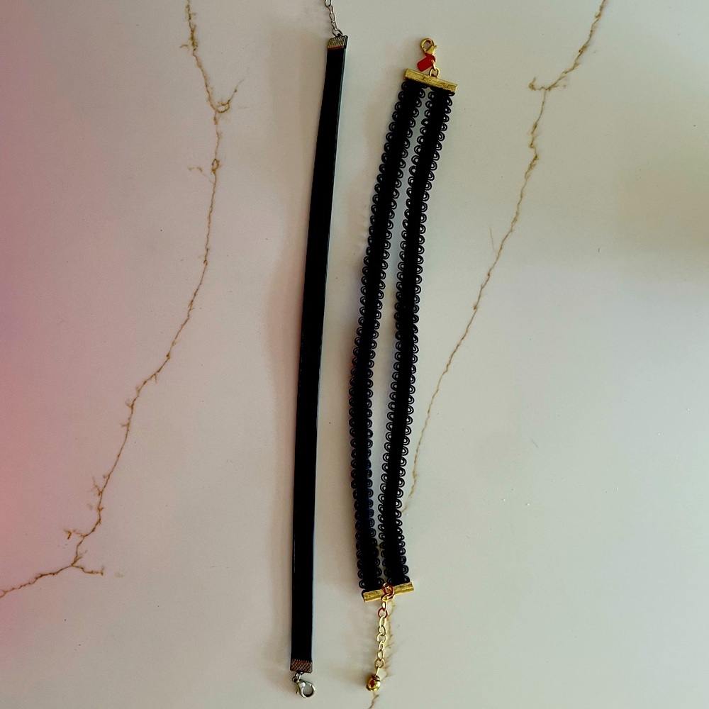 1 double choker and 1 solid black choker